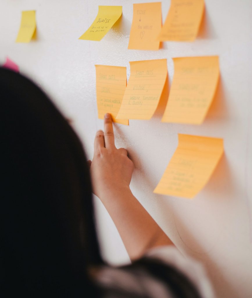 Woman reviewing sticky notes